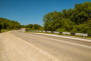 Image showing Curved asphalt road in mountains 