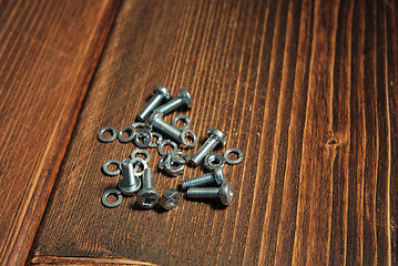 Image showing Screws on the wooden background
