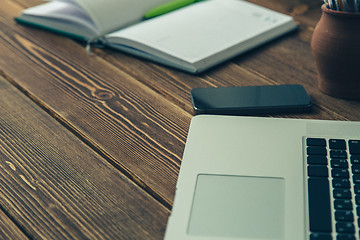 Image showing Laptop and diary on the desk