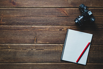 Image showing notebook and vintage camera on the desk