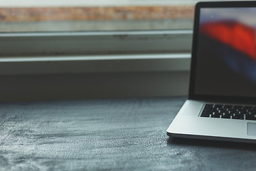 Image showing Laptop on modern wooden desk 