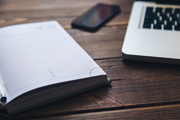 Image showing Laptop and diary on the desk