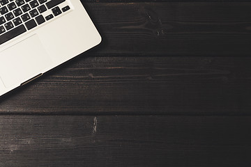 Image showing Laptop on modern wooden desk 