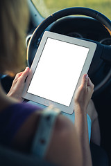 Image showing Woman using tablet pc in the car