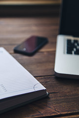 Image showing Laptop and diary on the desk