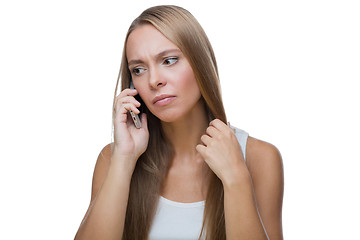 Image showing Sad woman talking on phone