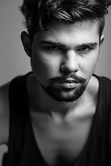 Image showing Black and white portrait of a young man in a black t-shirt