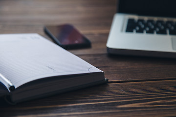 Image showing Laptop and diary on the desk