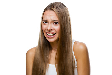 Image showing Portrait of frowned woman on white background