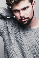 Image showing Portrait of a young man in gray pullover