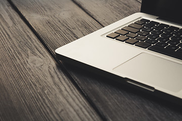 Image showing Laptop on modern wooden desk 