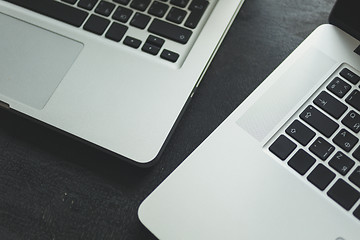 Image showing Two laptops on modern wooden desk 