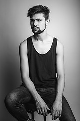 Image showing Black and white portrait of a young man in a black t-shirt