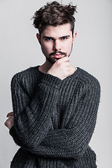 Image showing Portrait of a young man in gray pullover