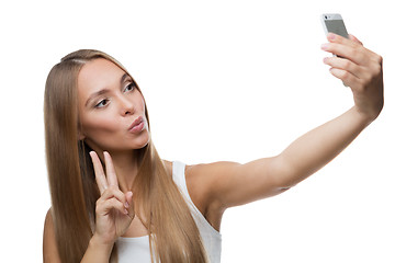 Image showing beautiful woman make selfie on white background