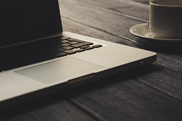 Image showing Laptop on modern wooden desk 