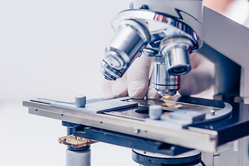 Image showing Scientist hands with microscope