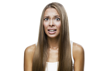 Image showing Portrait of frowned woman on white background