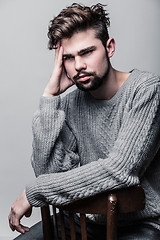 Image showing Portrait of a young man in gray pullover