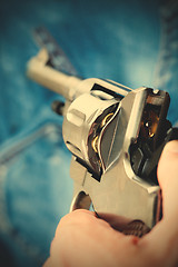 Image showing pistol in hand, close-up