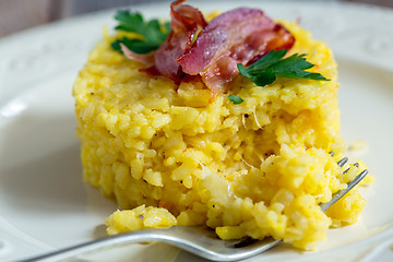 Image showing Portion of risotto with bacon and parsley.