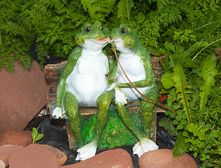 Image showing Two green ornament frog