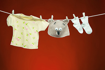 Image showing Baby goods hanging on the clothesline