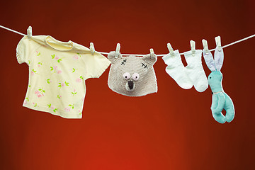 Image showing Baby goods hanging on the clothesline