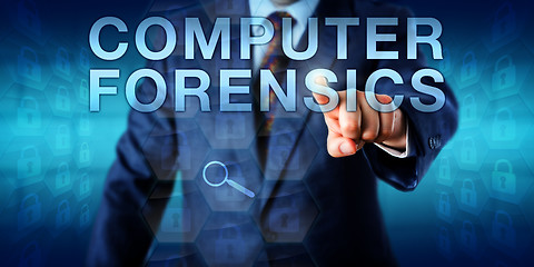 Image showing Forensic Expert Pressing COMPUTER FORENSICS