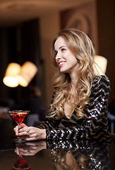 Image showing glamorous woman with cocktail at night club or bar