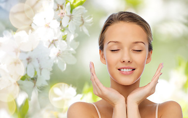 Image showing smiling young woman face and hands