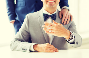 Image showing close up of male gay couple with wedding rings on