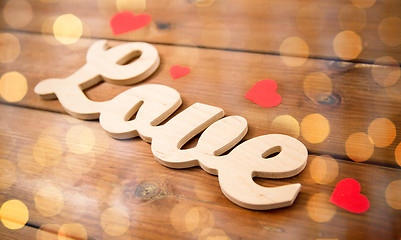 Image showing close up of word love with red paper hearts