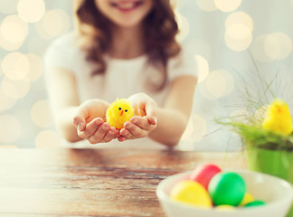 Image showing close up of girl holding easter chicken toy