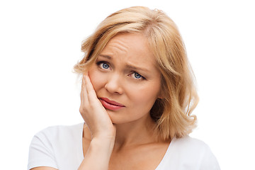Image showing unhappy woman suffering toothache