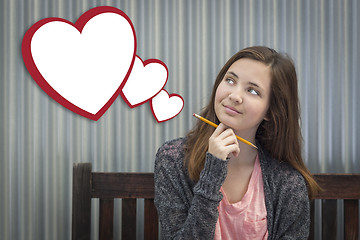 Image showing Daydreaming Girl With Blank Floating Hearts - Clipping Path