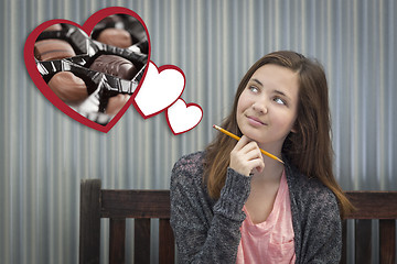 Image showing Daydreaming Girl Next To Floating Hearts with Chocolates