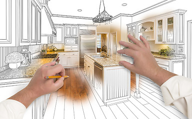 Image showing Male Hands Sketching Custom Kitchen with Photo Showing Through