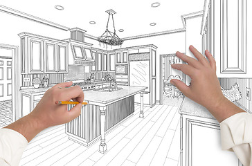 Image showing Male Hands Sketching Beautiful Custom Kitchen