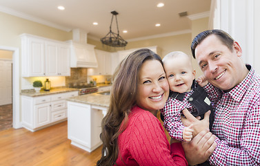 Image showing Young Family Inside Beautiful Custom Kitchen