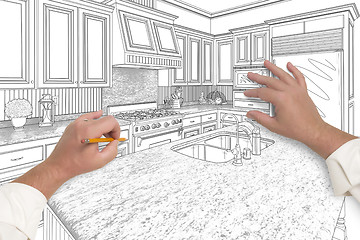 Image showing Male Hands Sketching Beautiful Custom Kitchen