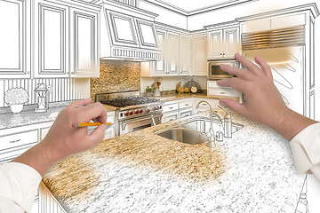Image showing Male Hands Sketching Custom Kitchen with Photo Showing Through