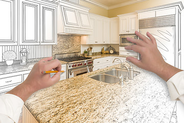 Image showing Male Hands Sketching Custom Kitchen with Photo Showing Through