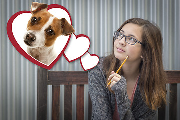 Image showing Daydreaming Girl Next To Floating Hearts with Puppy Within