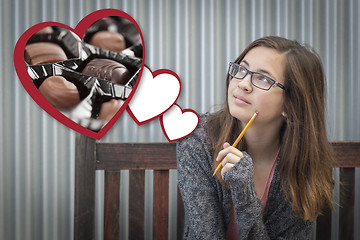 Image showing Daydreaming Girl Next To Floating Hearts with Chocolates