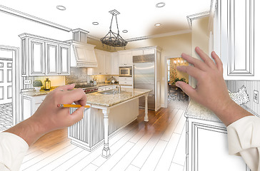 Image showing Male Hands Sketching Custom Kitchen with Photo Showing Through