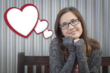 Image showing Daydreaming Girl With Blank Floating Hearts - Clipping Path