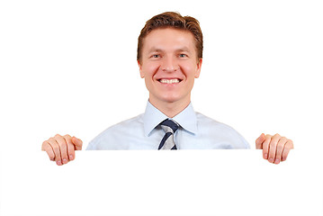 Image showing Confident business man holding a white board for copy-space