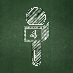 Image showing News concept: Microphone on chalkboard background