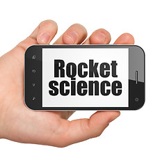 Image showing Science concept: Hand Holding Smartphone with Rocket Science on display